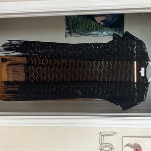 Black, laced beach cover up . Gently used. Size medium .